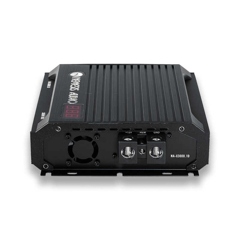 3080W RMS Class D Monoblock Amplifier. Features 1-Ohm stability, a compact 8.94″ chassis, and an included remote bass knob with a digital voltmeter.